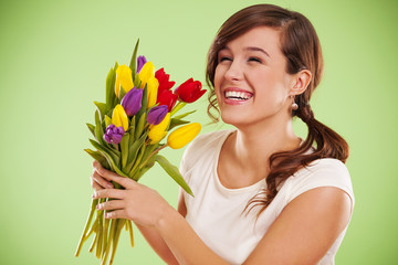 Laughing woman with tulips