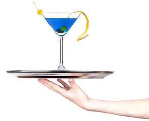 hand with alcohol cocktail on a silver tray
