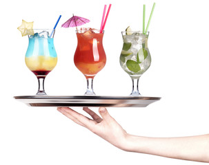 hand with alcohol cocktail on a silver tray