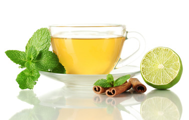 Cup of tea with mint,cinnamon and lime isolated on white