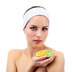 Young woman with fruit.Concept: Facial fruit masks. Isolated