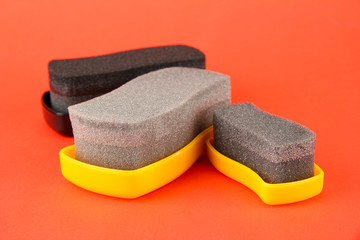 Shoe shine sponges, on color background