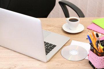 Cup of coffee on office desktop close-up