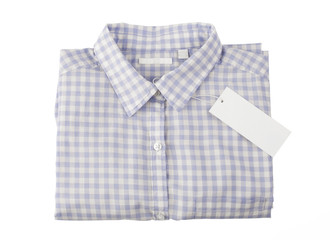 Blue plaid shirt with tag isolated on white background