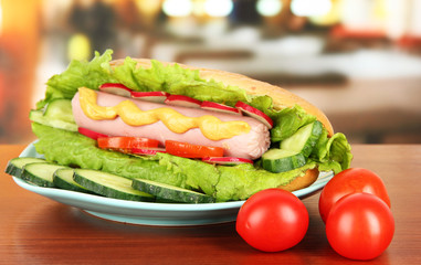 Tasty hot dog on table in cafe