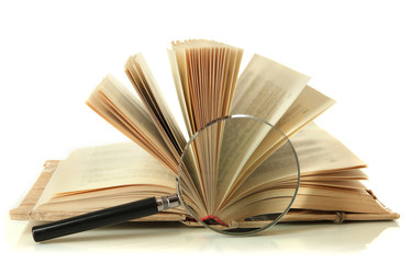 Magnifying glass and open book isolated on white
