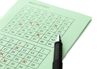 Lottery ticket and pen, isolated on white