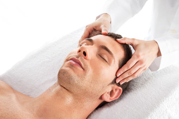 Fototapeta na wymiar Closeup of a man having a head massage