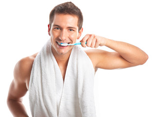 Young man brushing his teeth