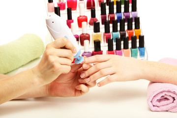 Manicure process in beauty salon, close up