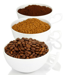 Different types of coffee in three cups isolated on white