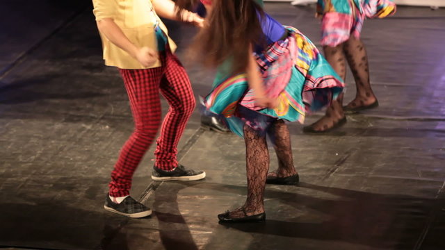 Fragment of fast Rock and roll with bright dressed dancers