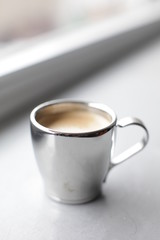Espresso pouring into a cup