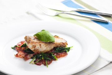 tilapia fillet with warm spinach and bacon salad