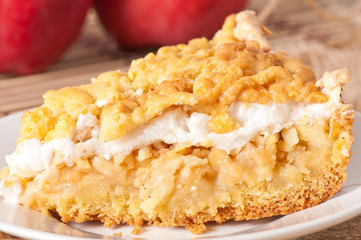 ing slice of pie with apples and meringue layer