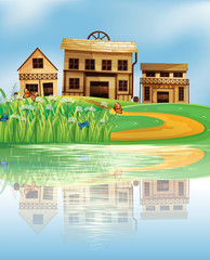 Un étang avec un reflet des maisons en bois