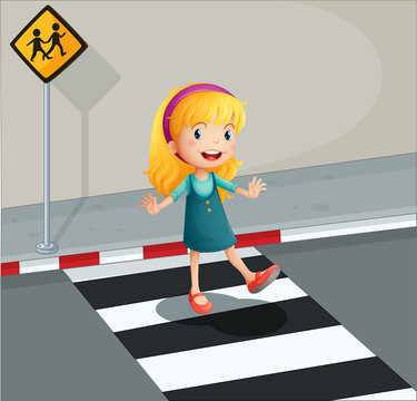 A young lady crossing the pedestrian lane