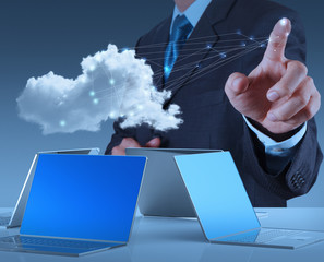 Businessman working with a Cloud Computing diagram on the new co