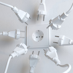 Many Electric Plugs are Fighting for Power from the Wall Socket