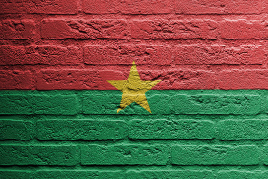 Brick wall with a painting of a flag, Burkina Faso