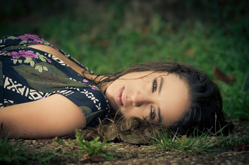 calm woman laying in the park