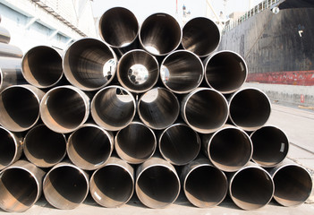 stack of rounded steel pipes