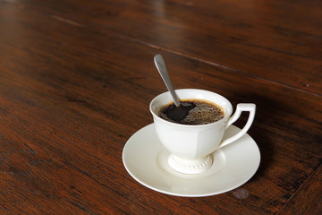 Coffee cup with on grunge wood