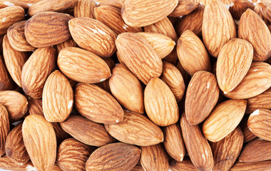 Pile of almonds closeup as background