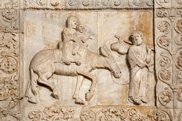 Fototapeta na wymiar Verona - Relief of Flight to Egypt on San Zeno church