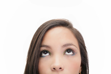 Obraz premium Closeup portrait of a beautiful young woman looking up, isolated