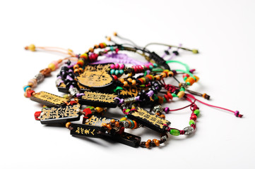 Heap of wooden  bead accessories on white. Homemade jewelry.