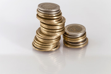 Turkish Lira coins on top of each other on reflective surface