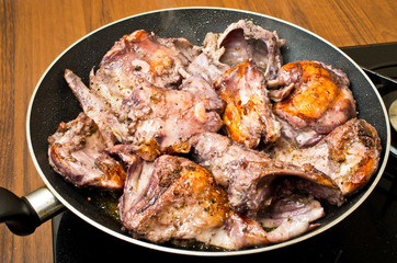 Fototapeta premium Pieces of the rabbit on the pan
