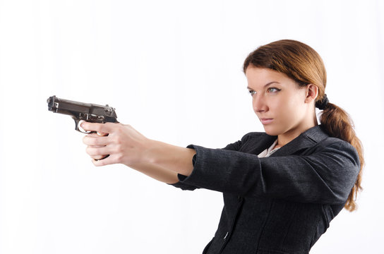 Woman businewoman with hand gun