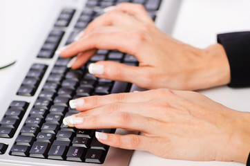 Hands working on the keyboard