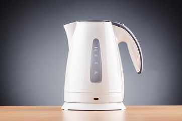 White kettle against grey background