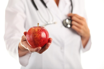 Female doctor with apple