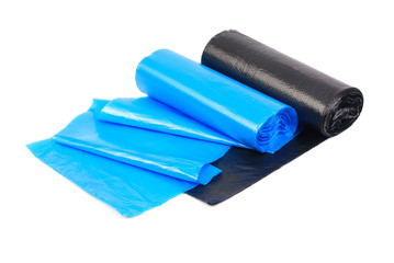 roll of blue and  black garbage bags on a white background