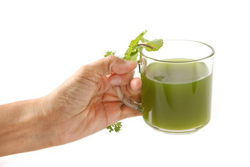 woman hand give a healthy green vegetable juice
