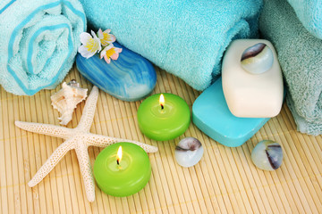 Towels, soaps, flowers, candles