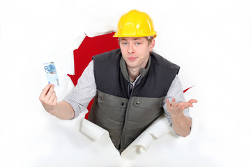 Workers coming out of torn paper hole with ticket in hand