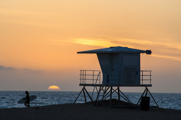 Naklejka premium huntington Beach surfer sunset