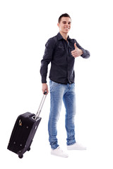 Young traveler carrying his luggage