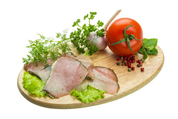 Ripe fresh ham with vegetables