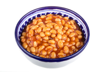 Marinated haricot beans in tomato sauce with shallots on a plate