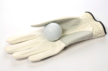 Golfball auf Golfhandschuh