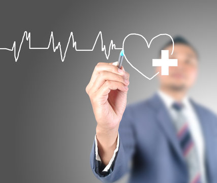 business man drawing health care of heart