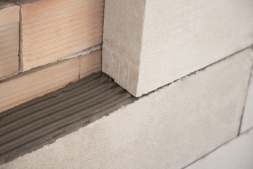 Wall of bricks and Ytong under construction