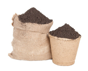 Sack of soil and peat pot