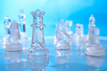 glass chess on the blue background